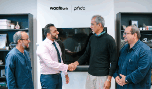 Dr. Ashraf Iqbal shaking hands with Pfida's CEO and founder, Raza Ullah